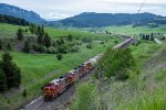 BNSF 4719 leads an eastbound grain train towards Bozeman Pass Tunnel 